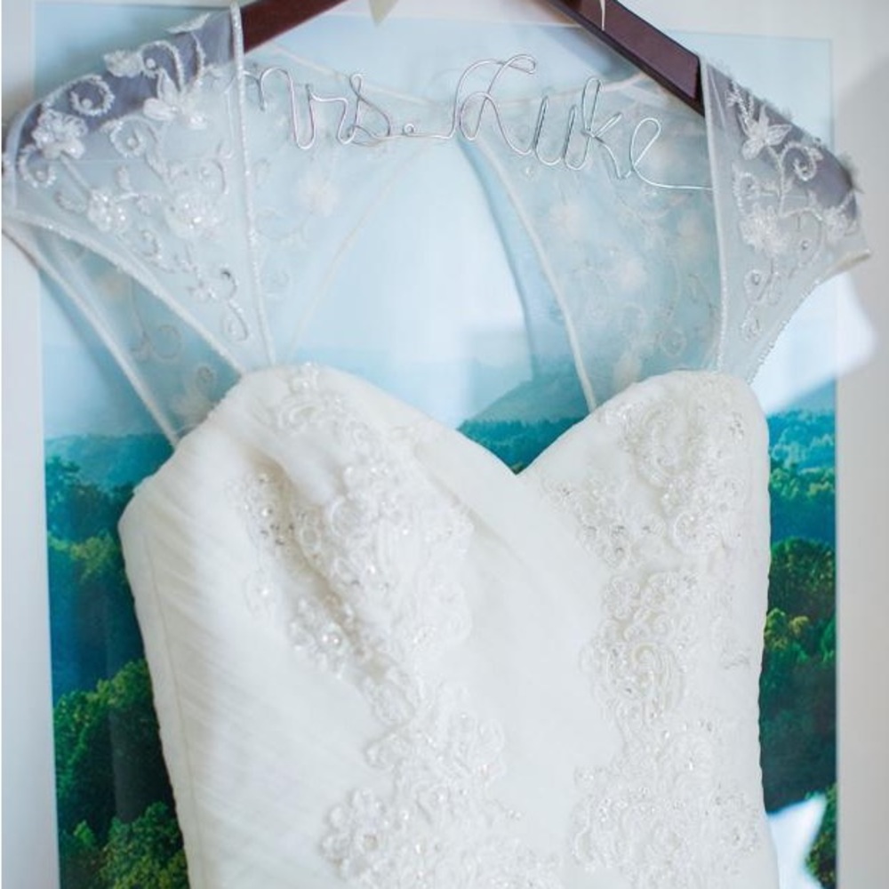 Pristine wedding dress by Blue, in ivory